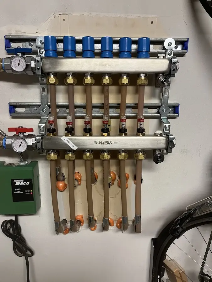 Plumber performing Water Heater Repair at a residential property in Garland